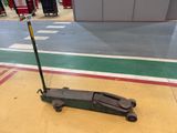 a scooter that is sitting on the floor in the garage