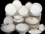 a lot of plates and bowls that are stacked together