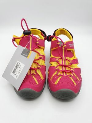 a pair of pink and yellow shoes with a tag on them