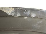 a close up of a tire with a hole in the tire