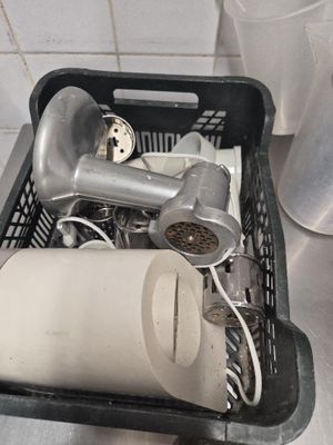 a basket full of hair dryers and other items on the counter
