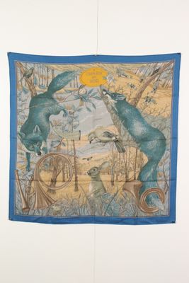 an image of a blue and yellow scarf hanging on a wall