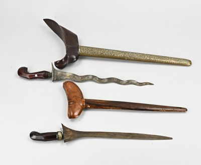 four different types of knifes are displayed on a white surface