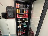 a refrigerator that has a lot of drinks inside of it