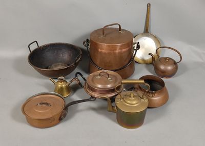 many pots and pans that are sitting on a table