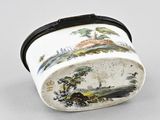 a close up of a small container with a painting on it