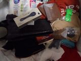 a pile of clothes and other items in a bag