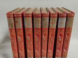 a set of five red books sitting on top of each other