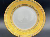 an image of a yellow and blue plate on a stand