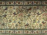 an oriental rug with birds and flowers on a white background