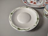 a plate and a cup sitting on a table