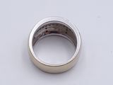 a close up of a ring on a white surface