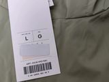 a close up of a jacket with a tag attached to it