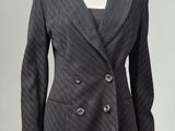 a woman ' s jacket and skirt suit on a mannequin mannequin mannequin mannequin mannequin mannequin mannequin mann