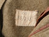 a label on the back of a jacket with a name on it