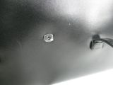 a close up of a black leather bag with a metal latch