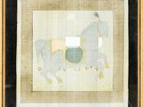 painting of a man riding a horse in a frame on a wall
