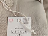 the label on a shirt is attached to the collar
