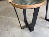 two tables that are sitting next to each other on the floor