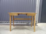 an image of a wooden table with a drawer on it