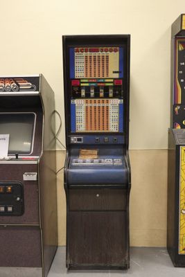 three arcade machines in a row next to each other