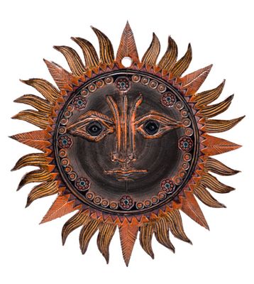 an image of a decorative sun face on a white background