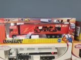 a toy truck that is sitting on top of a box