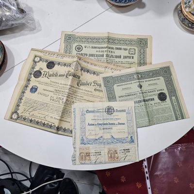 a table with a lot of old money on it