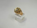 a close up of a gold ring with a diamond on it