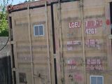 a large container that is sitting on the side of the road