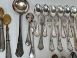 a lot of spoons and spoons that are on the table