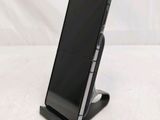 a cell phone that is sitting on a stand