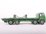 a green toy truck with chains attached to the back of it