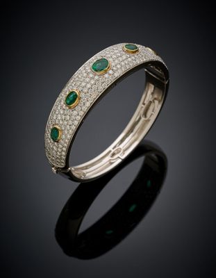 a diamond and emerald bangle bracelet