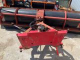 an image of a tractor with a large pipe attached to it ' s back