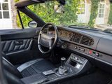 the interior of a car with a steering wheel and dashboard