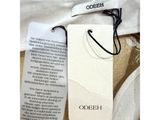 a close up of a label on a white shirt