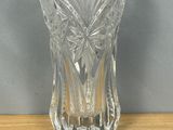 a glass vase that is sitting on a table