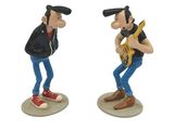two figurines of a man playing a guitar and a man playing a guitar