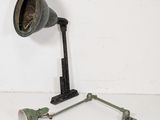 a lamp that is sitting on the floor next to a lamp