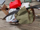 a wheelbarrow full of items on a wooden floor