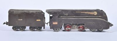 a toy train that is sitting on a white surface