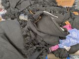a pile of clothing that is on a table
