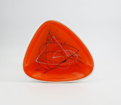 an orange triangle shaped plate with a drawing of a cat on it
