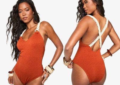 an image of a woman in an orange swimsuit posing for the camera