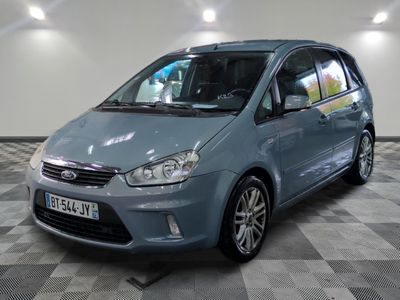 a picture of a small blue car parked in a garage