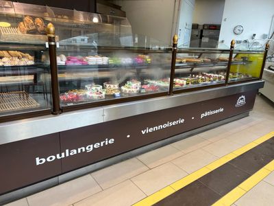 a display case with a variety of pastries in it