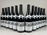twelve bottles of wine lined up in a row on a table