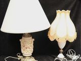 two lamps that are sitting next to each other on a table