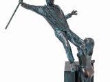 statue of a man holding a spear and a woman standing on a block